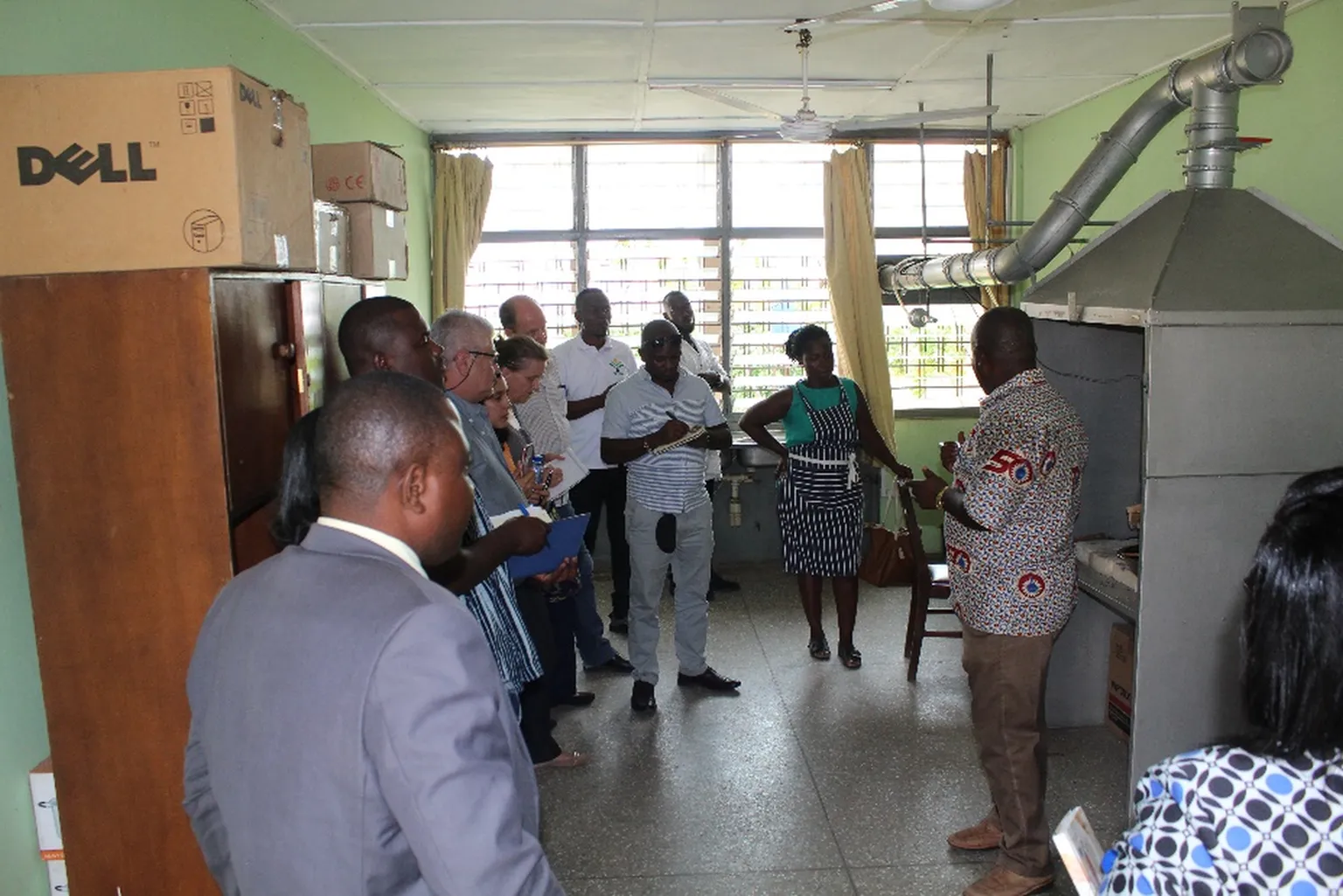 Participants get a demonstration at the Ghanaian stove testing center at CSIR