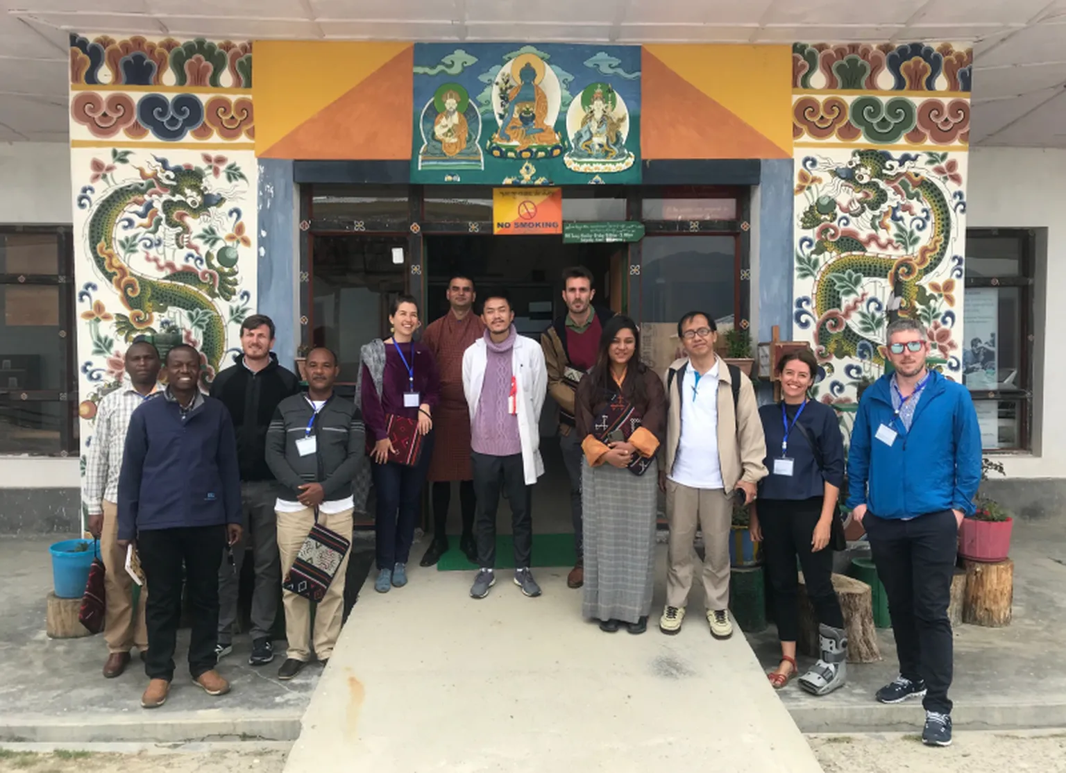 Group photo in front of a rural HCF, following engagements with HC practitioners