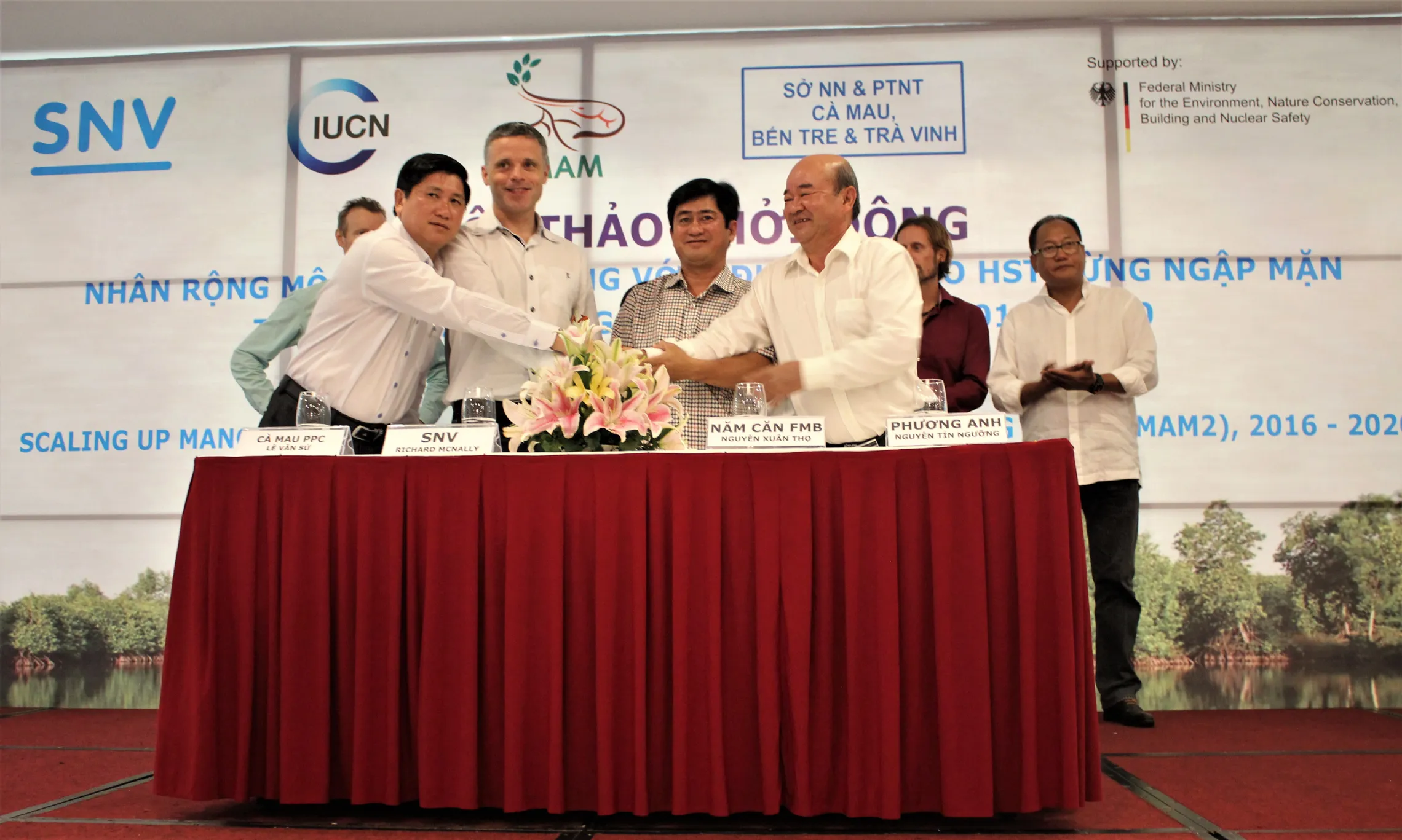 Signing ceremony for MoU between shrimp processing companies and the project