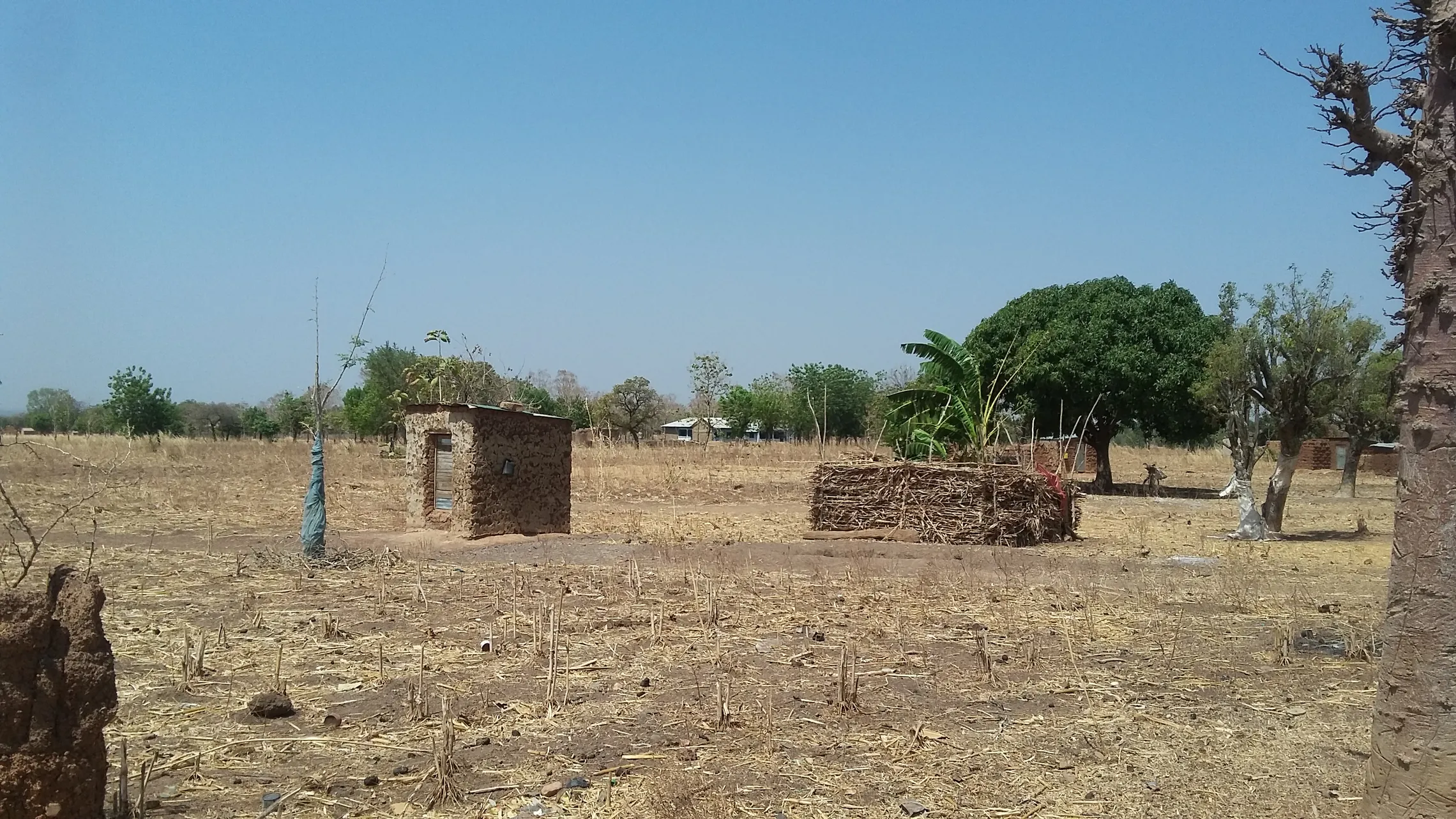 The latrine is located on the outskirts of the village