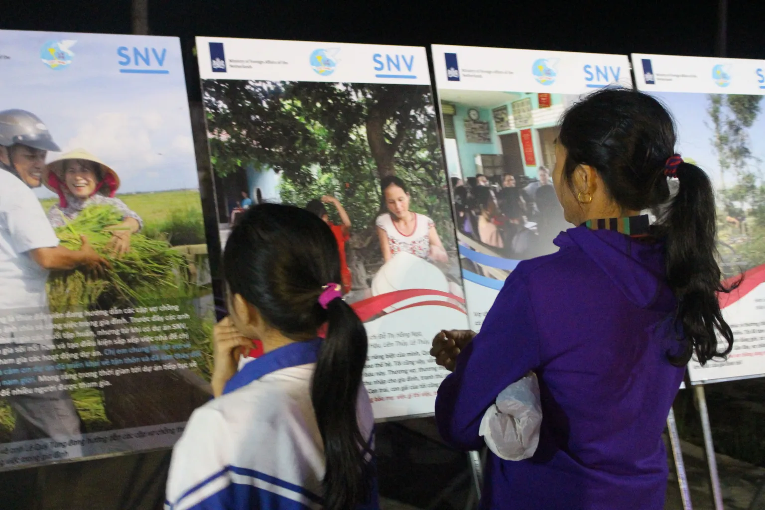 Visitors reading the stories of change in Quang Binh
