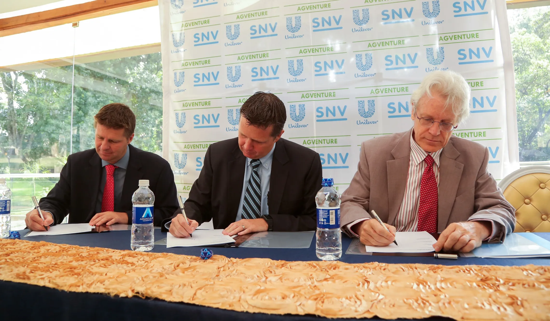 Don White, Justin Apsey and Tom Derksen signing the Memorandum