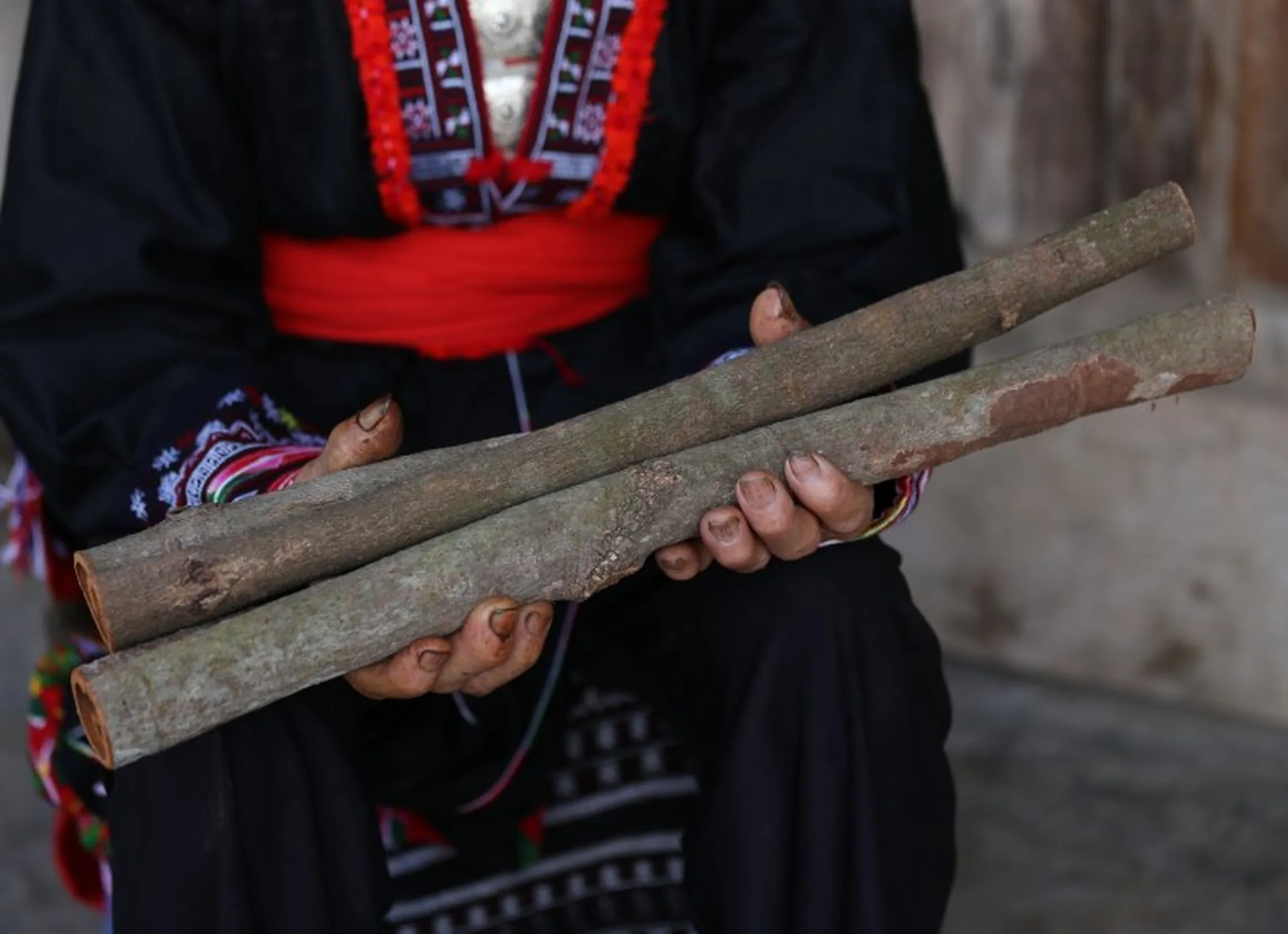 Woman holding sticks