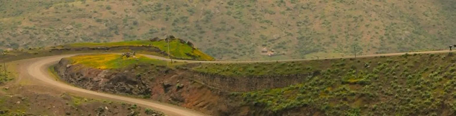 Dirt road through mountains