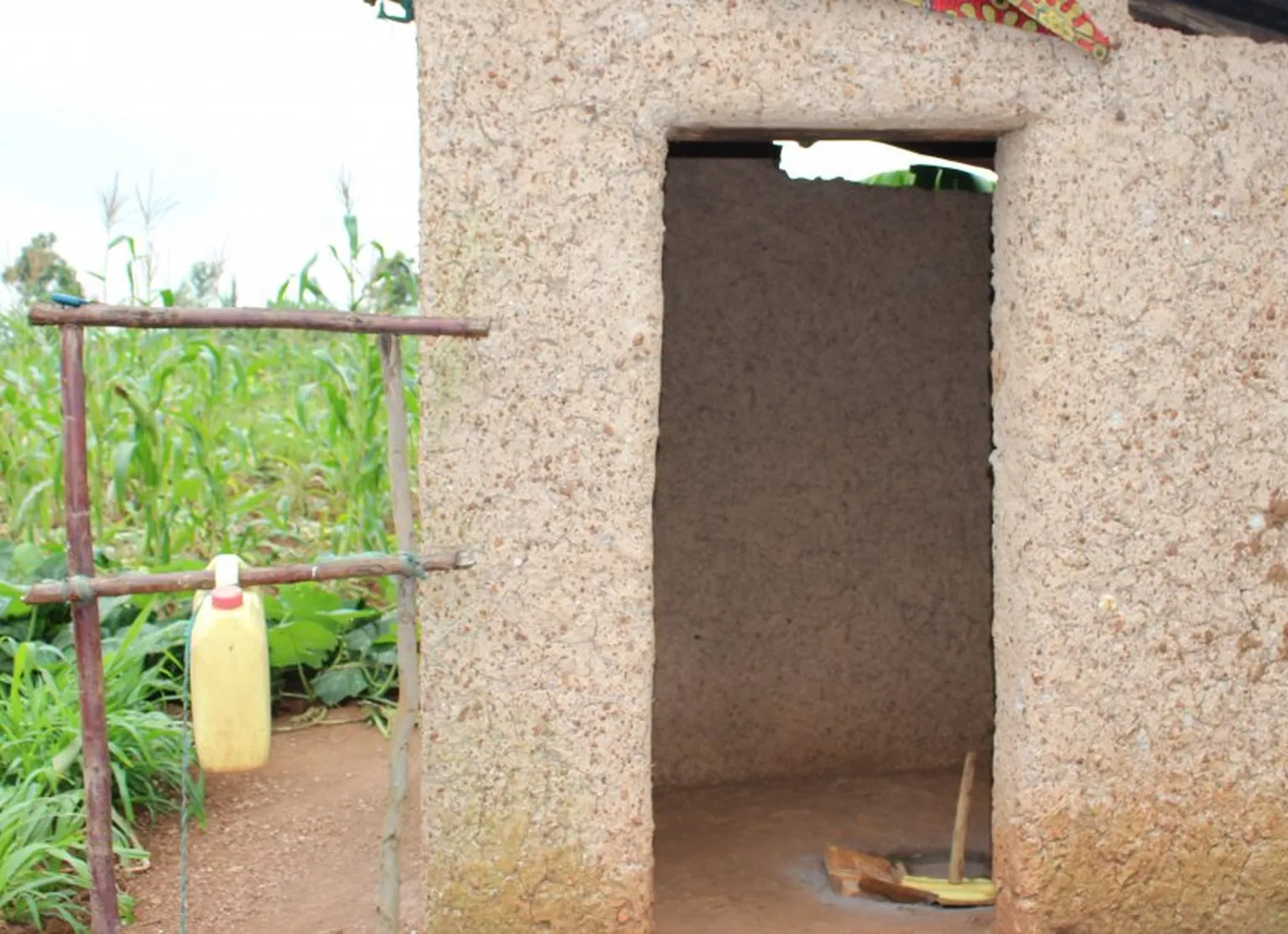 Mukamutesi’s newly improved latrine with a hand-washing station up close