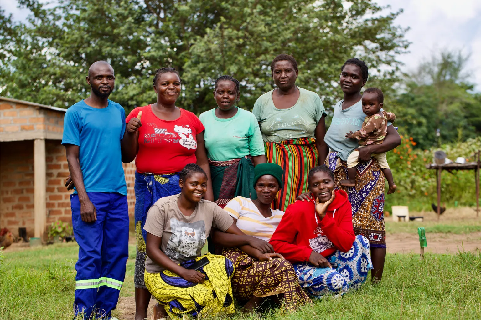 A group of young people pose to take a photo in Zambia