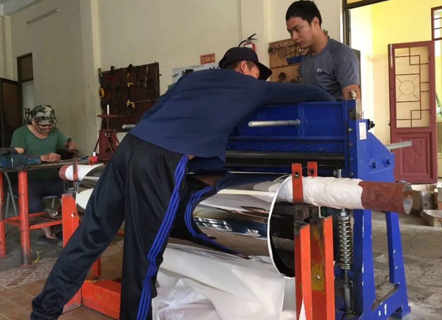 Manufacturing cookstoves at Solar Serve 