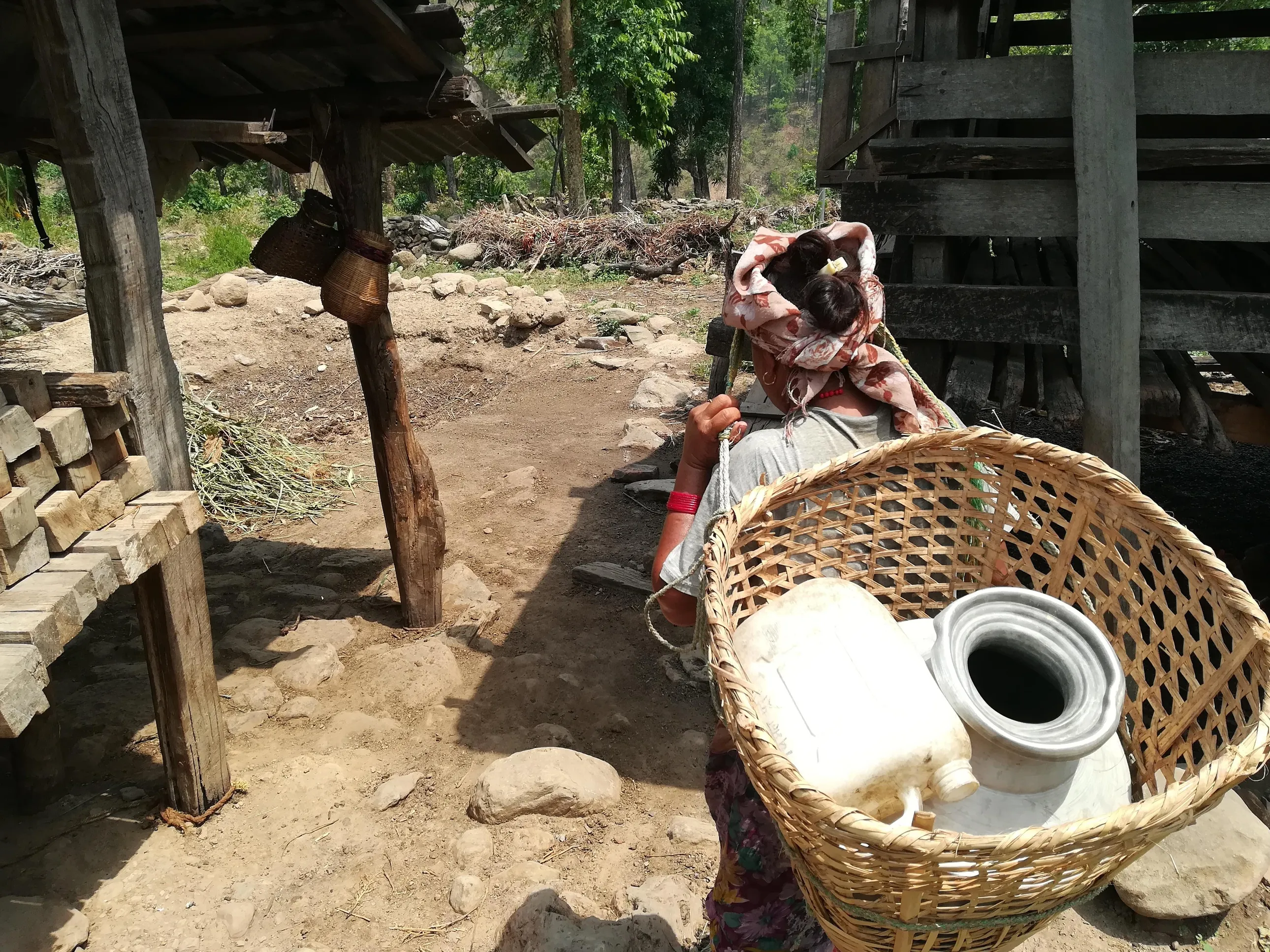 Woman gathering water for domestic use in a hilly area in Nepalgunj.