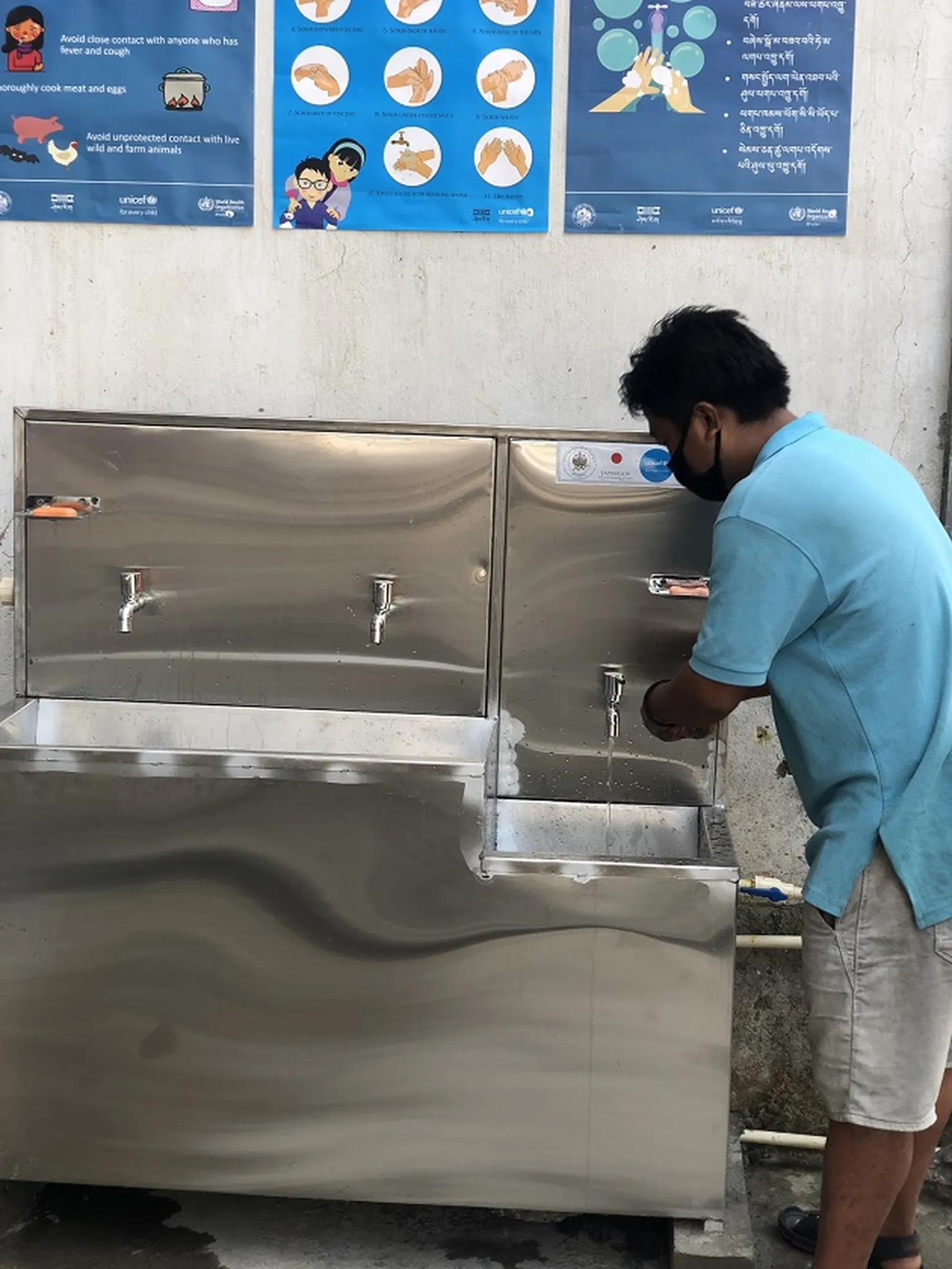 On right, a handwashing station within the reach of children