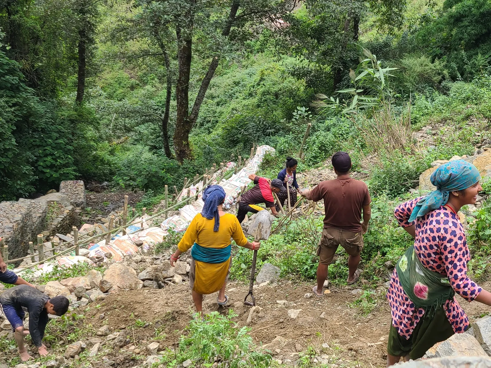 Nepali community mobilises to fortify area close to the water supply to reduce the impact of landslides.