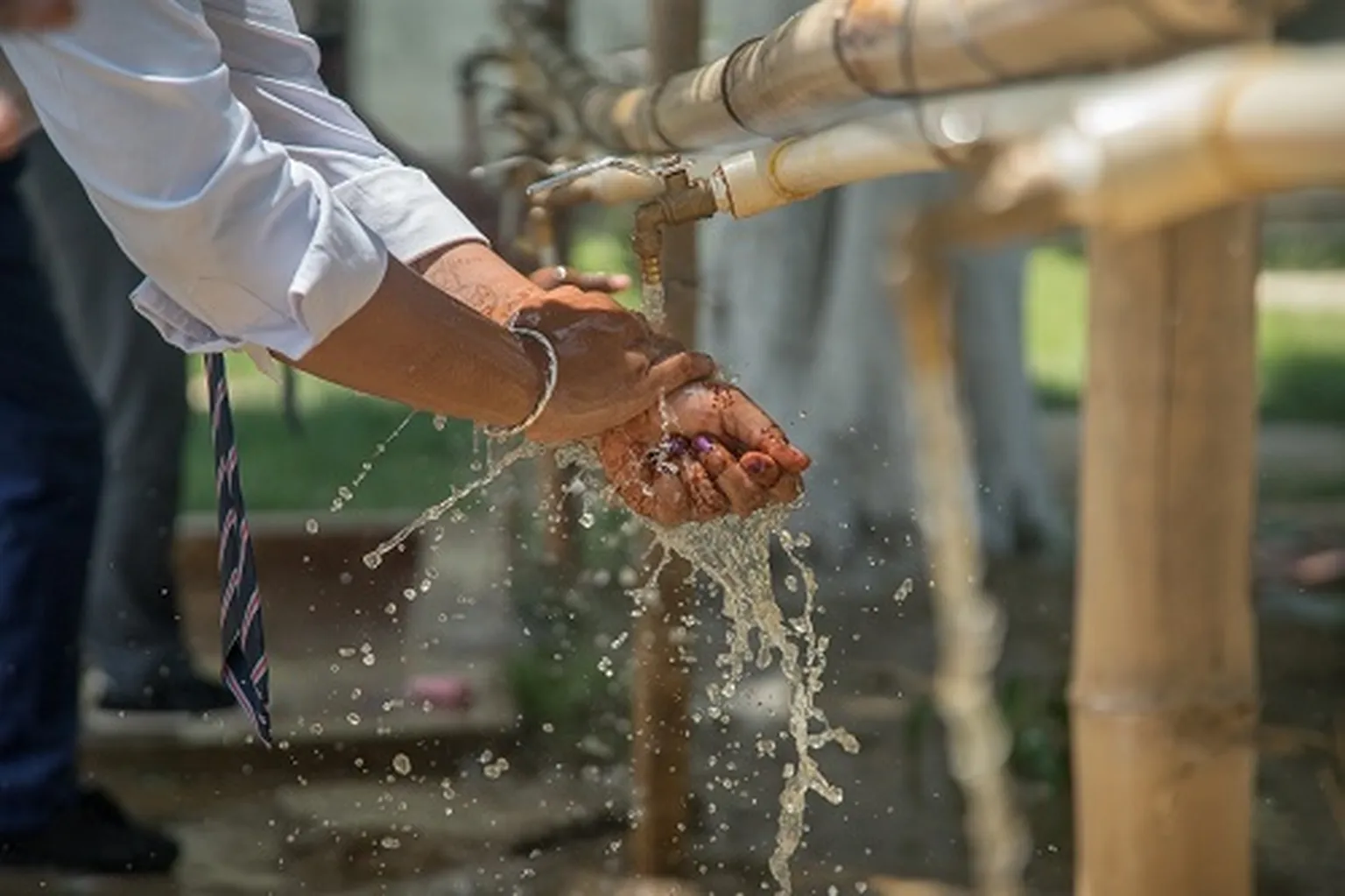 students washing their hands with soap