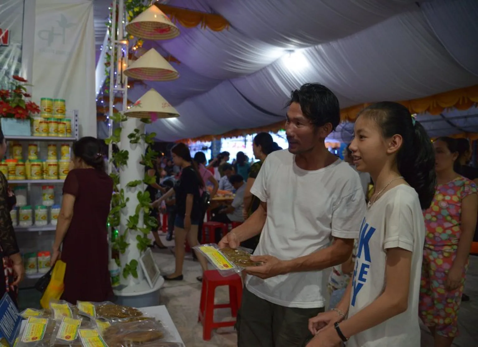 Visitors explore the products of women-led enterprises