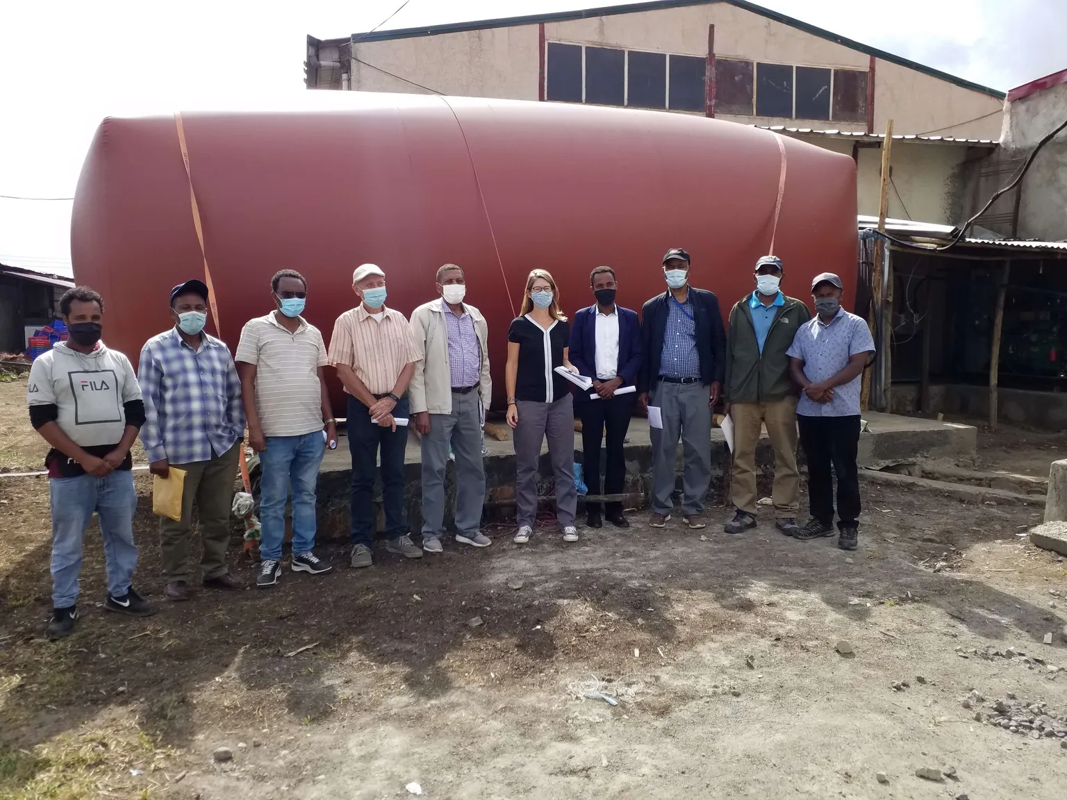 Image of the Ethiopia SNV team with a bio-digester 