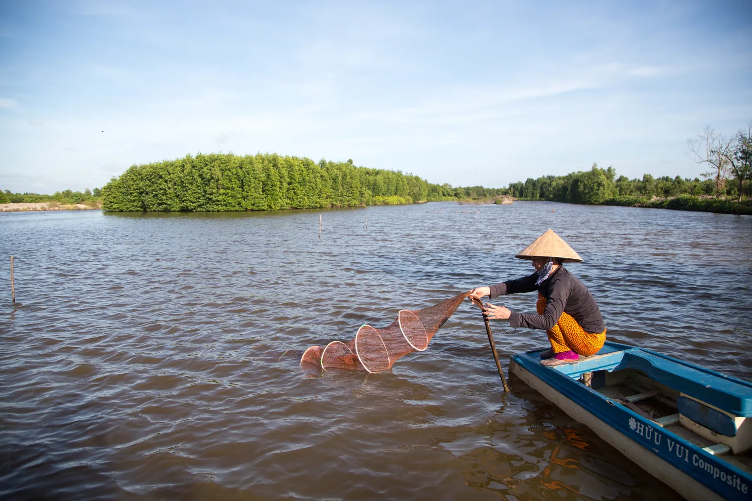 A woman engaged in shrimp farming in Ca Mau Vietnam, for Camimex in Vietnam with support from DFCD and SNV
