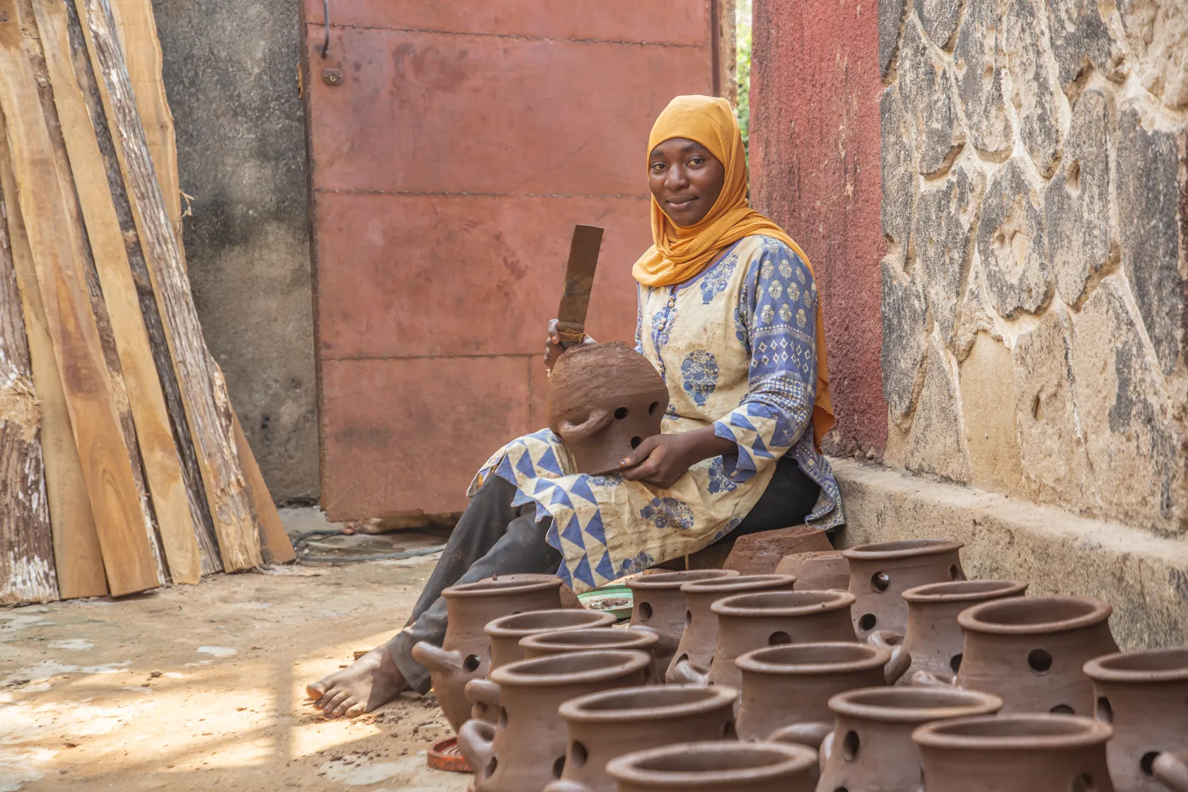Young person making cookstoves