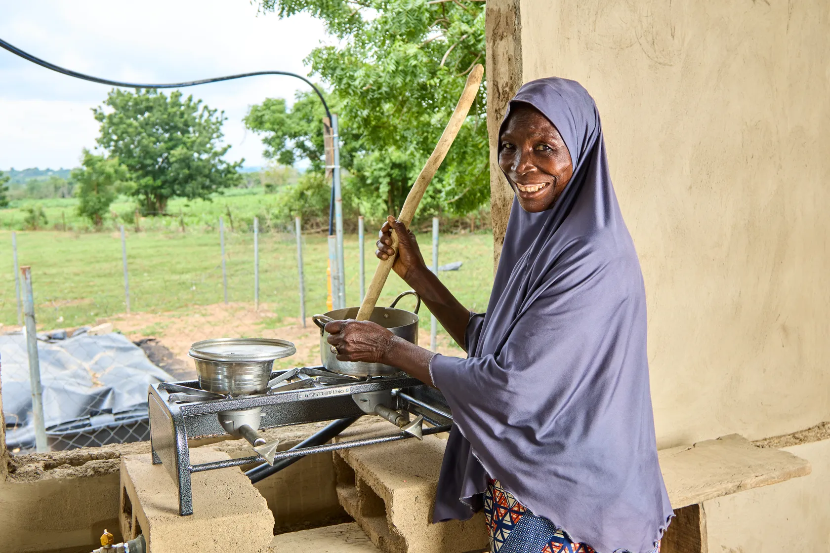 Woman cooking on biogas