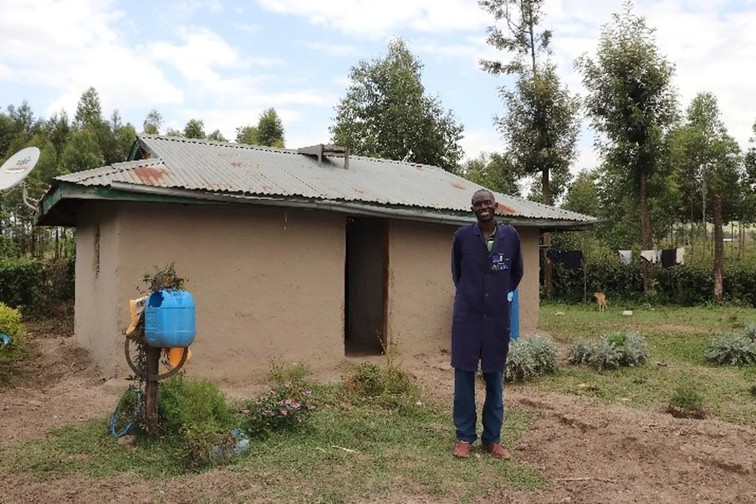 A photo of Stephen Bargero standing infront of his house