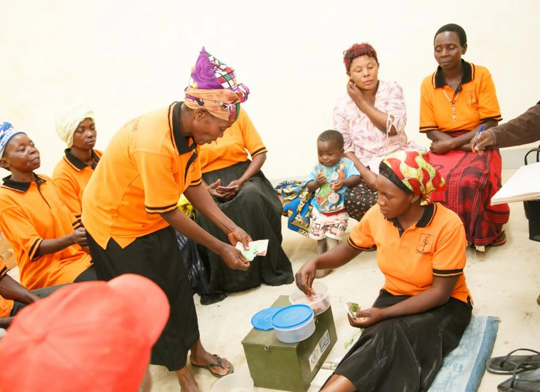 VSLA members meet to collect weekly savings and disburse loans