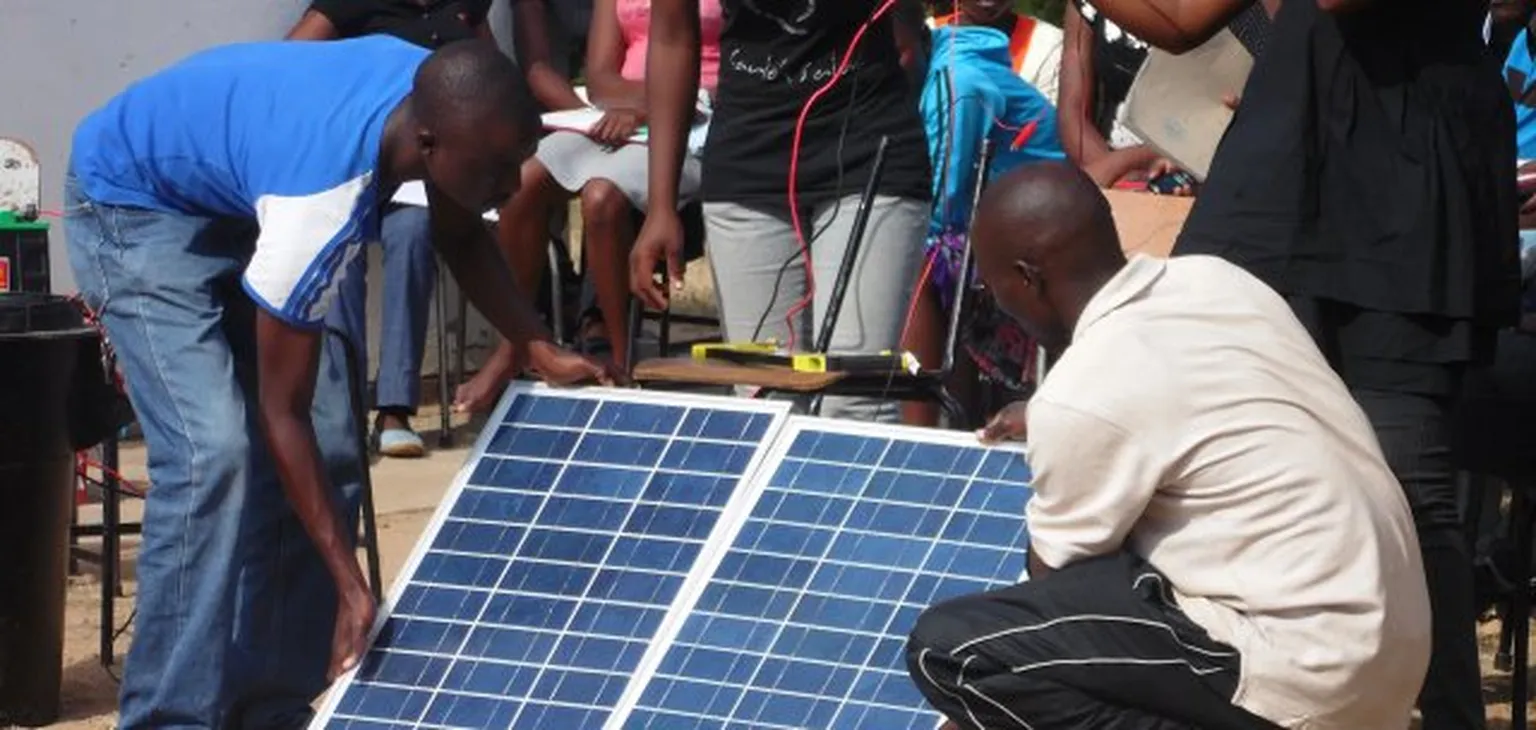 Group of guys working on solar panel
