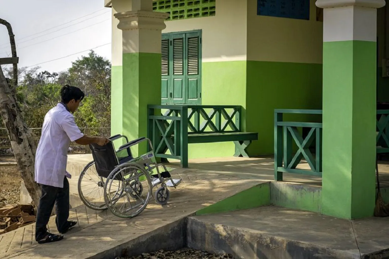 Nurse in Savannakhet, Lao PDR tests disability-inclusive entrance ramp