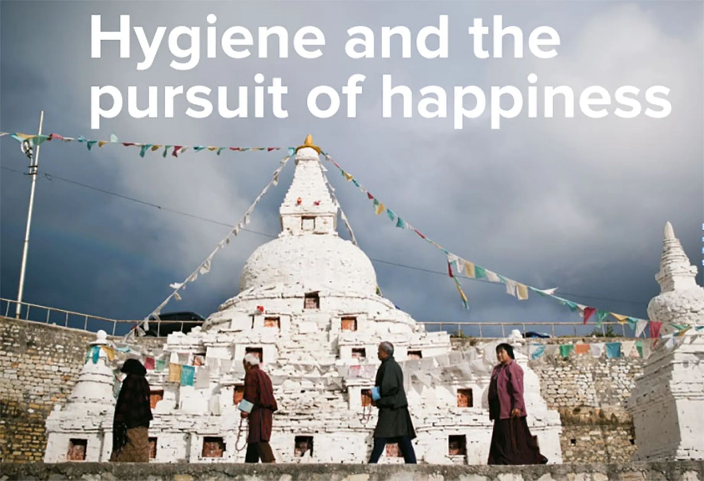 People walking past a white stupa with prayer flags, under the text "Hygiene and the pursuit of happiness".