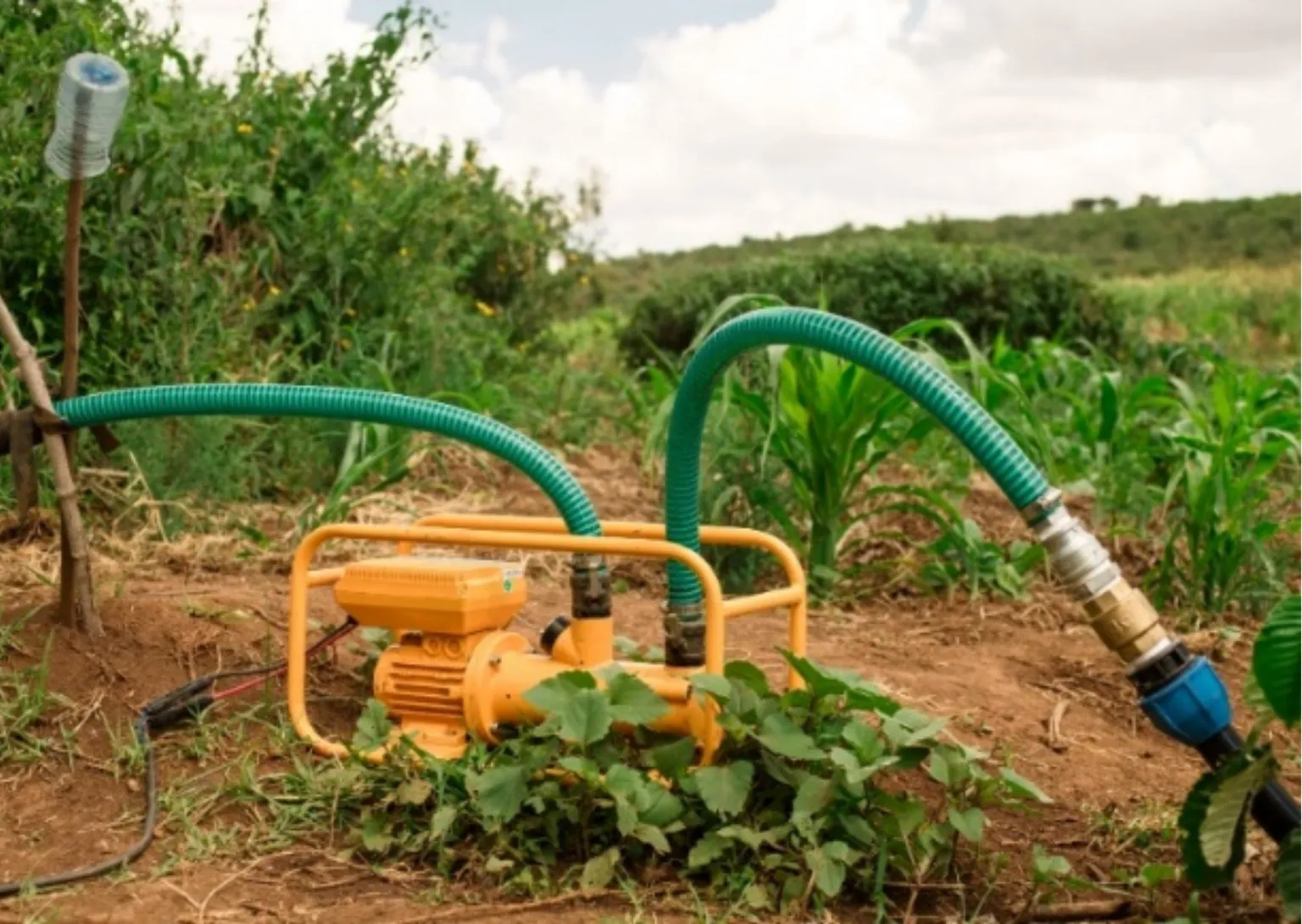 A photo of a yellow solar water pump.