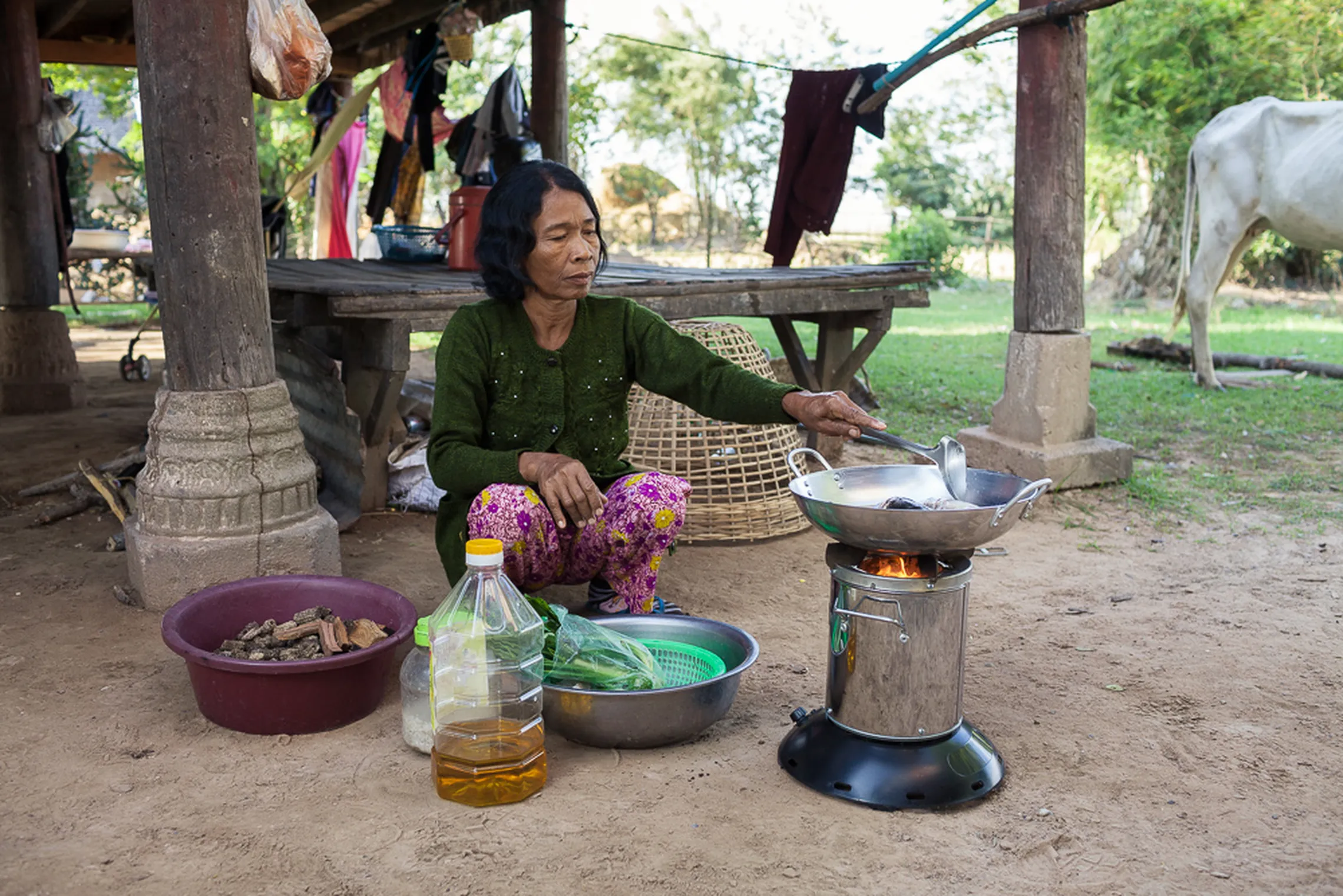 woman cooking on a cookstove