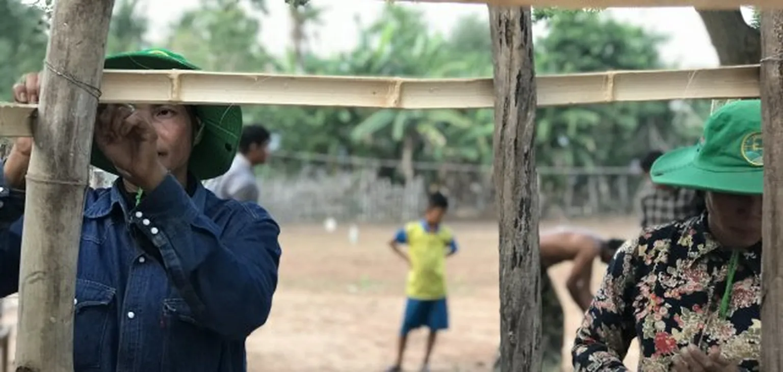 Man building bamboo construction