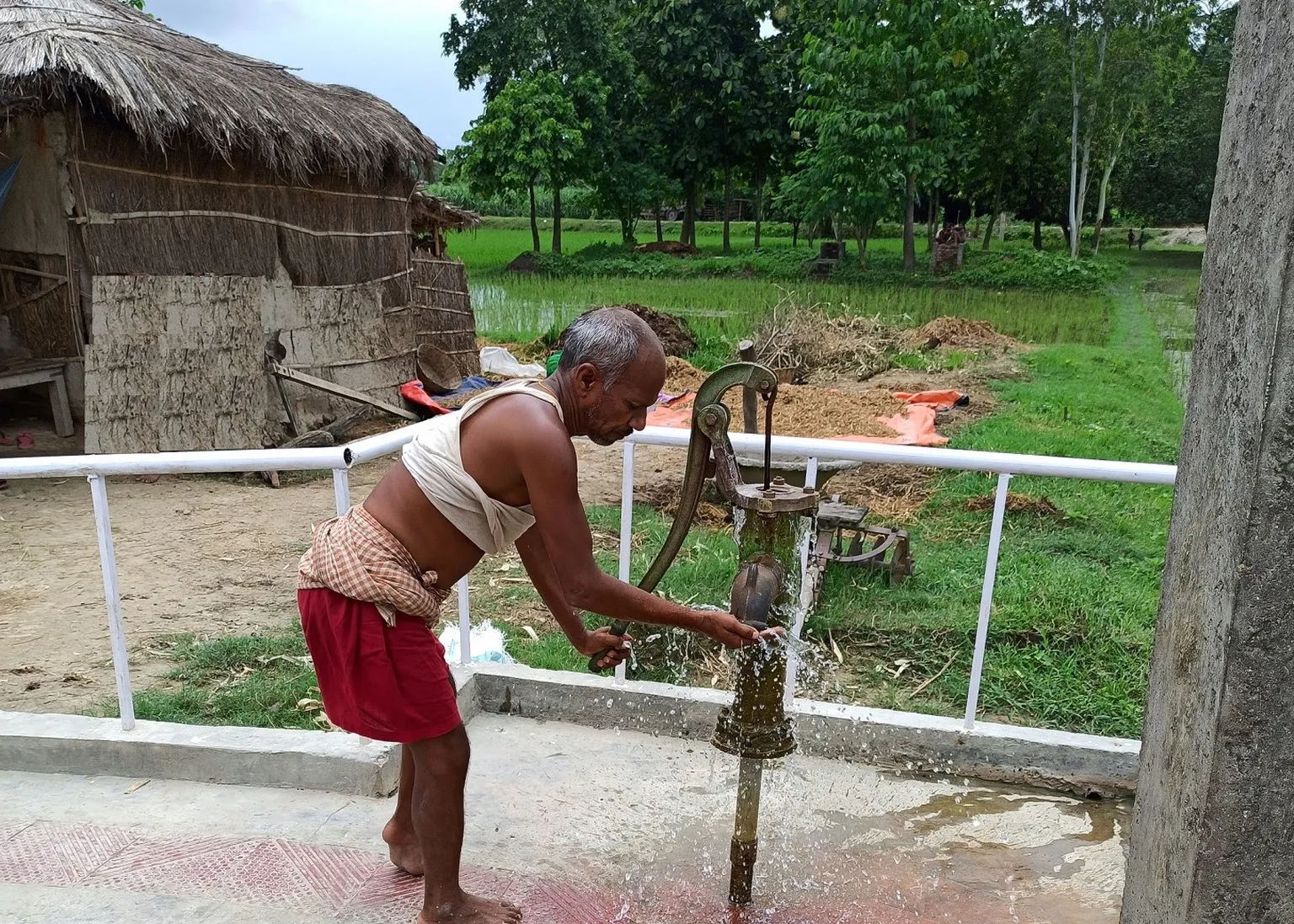 Person with disability uses handpump in Ramnagar municipality