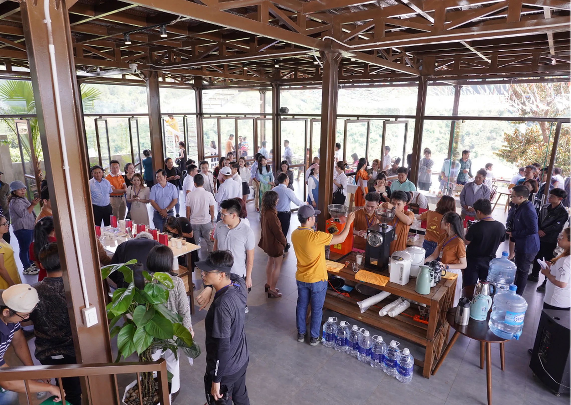 A photo of the event showing people tasting coffee in an event