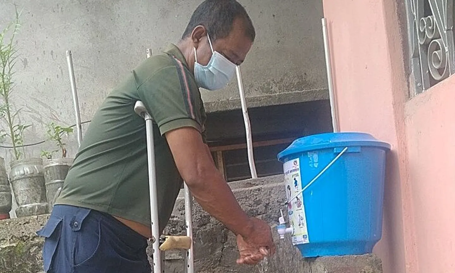 Person with disability using handwashing facility in Dailekh (Photo: SNV in Nepal)