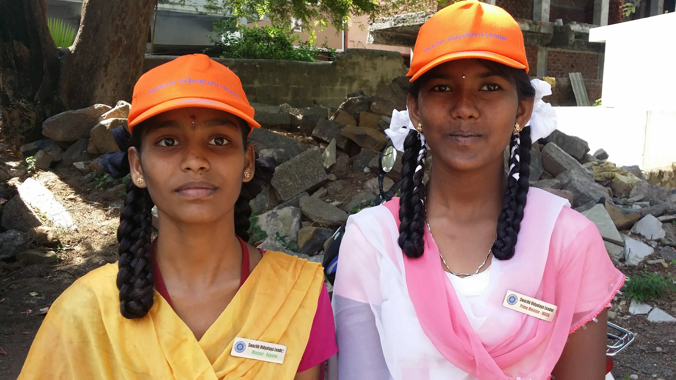 Students designated as Minister of Hygiene (left) and Prime Minister (right)