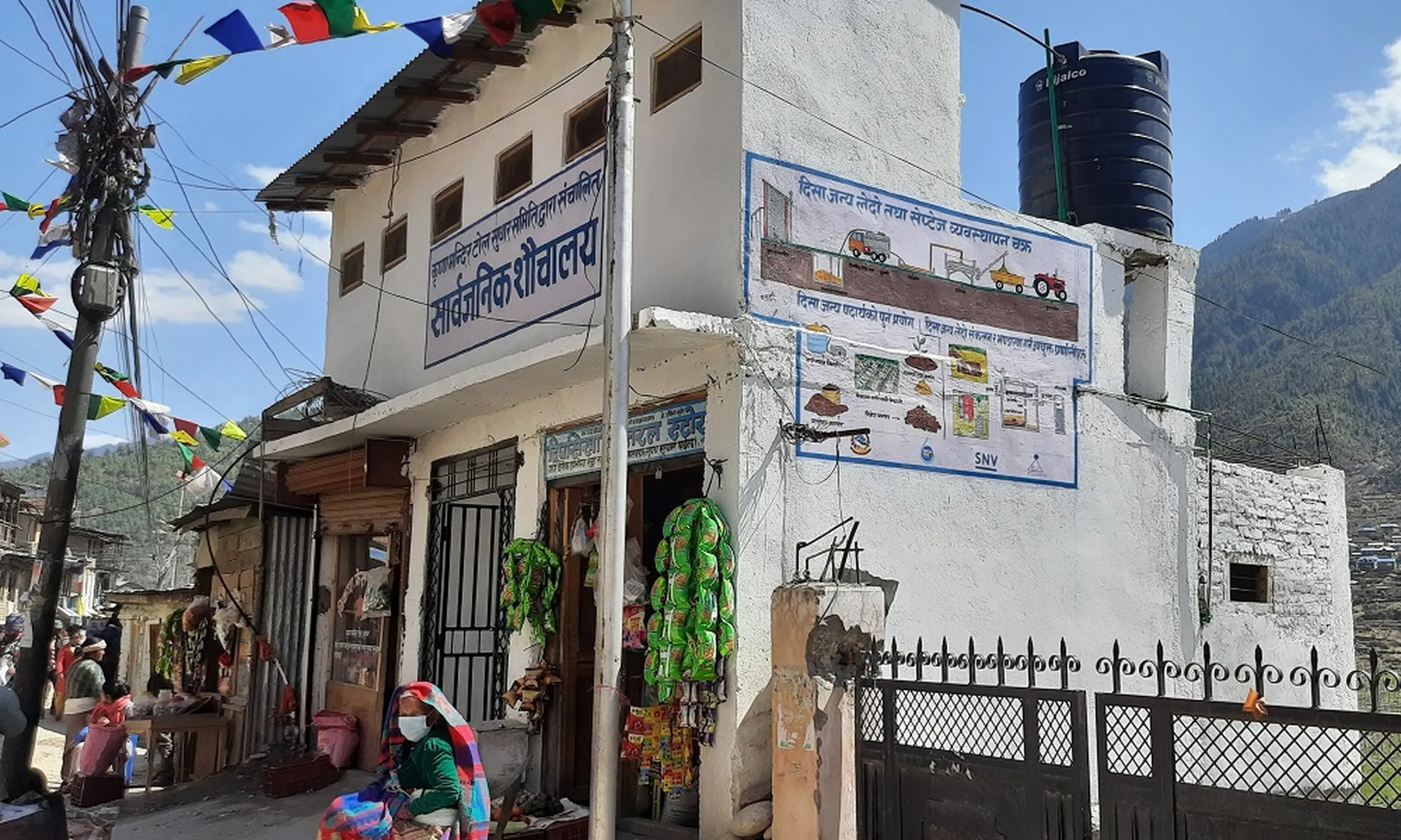 On the building's wall: sanitation value chain explained in visuals