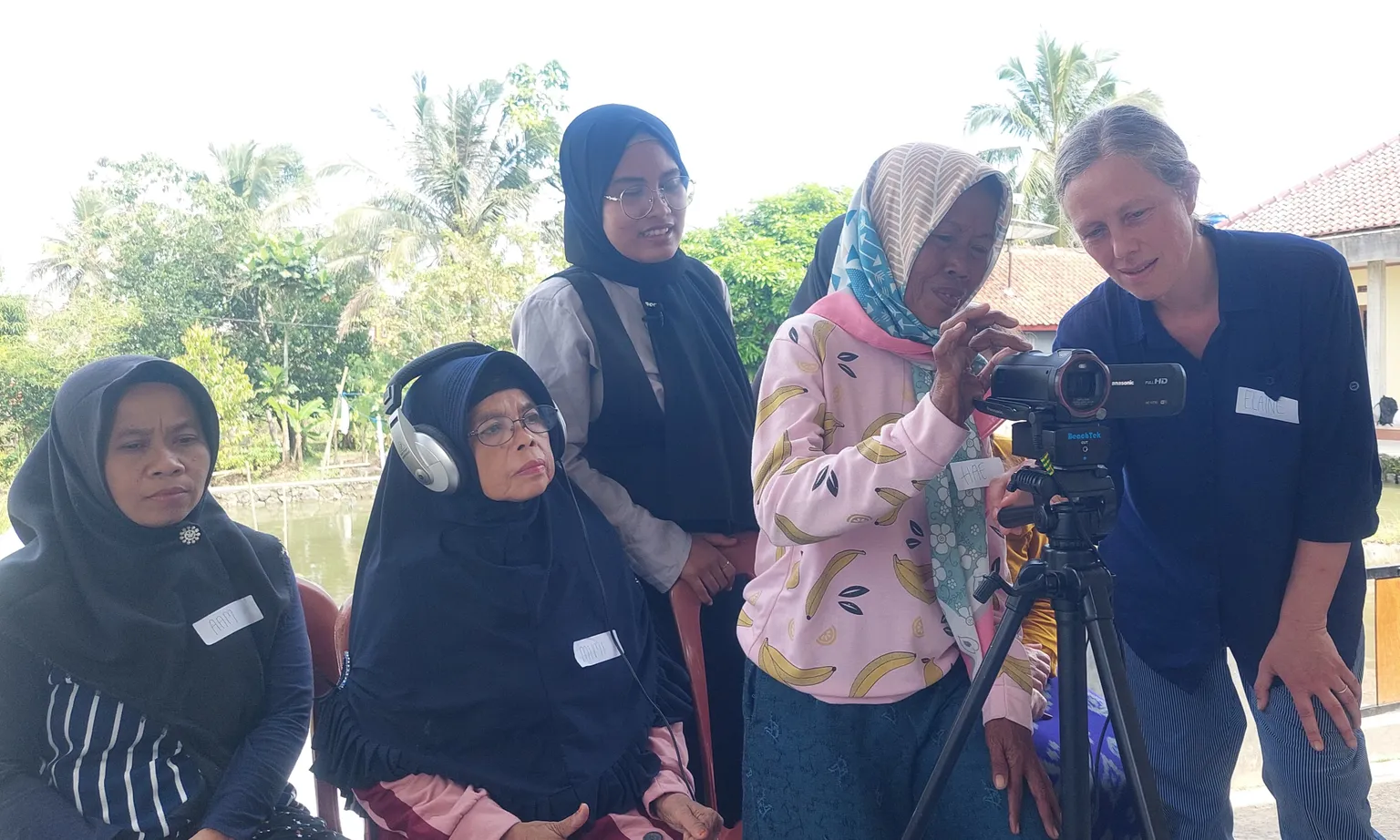 Older women partners of SNV in Indonesia participate in an SLTH sanitation video